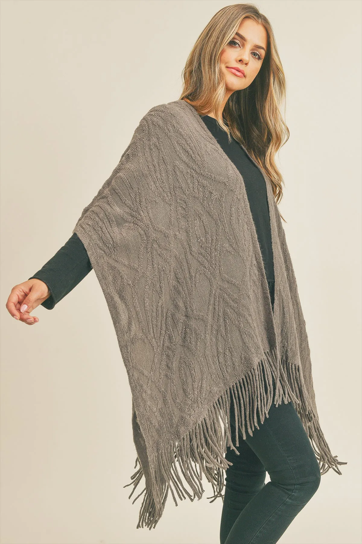 EMBOSSED PATTERN TASSEL RUANA
