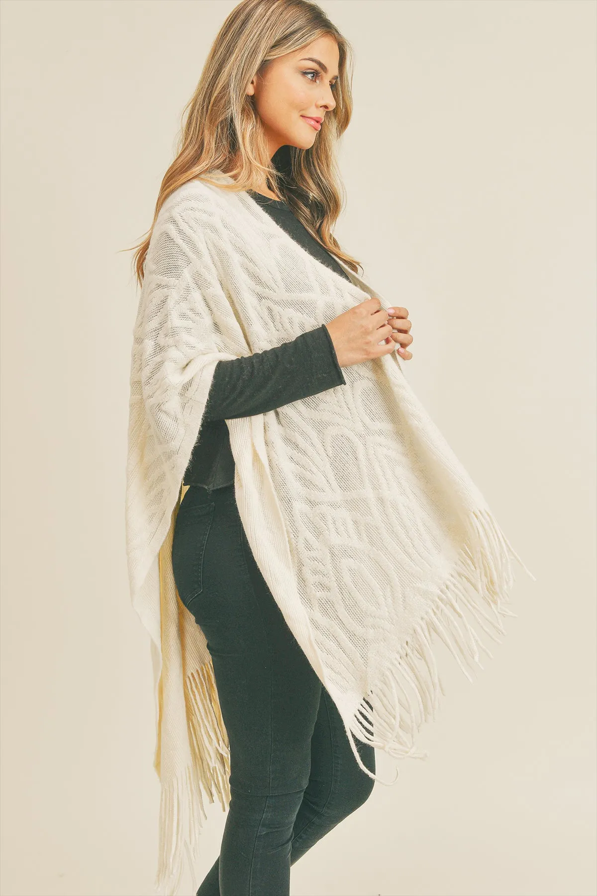 EMBOSSED PATTERN TASSEL RUANA