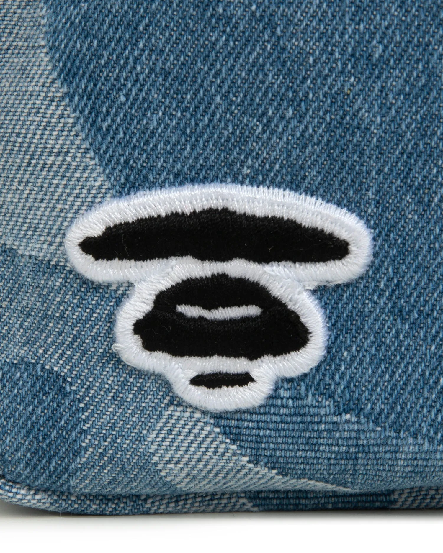 Moonface embroidered camo denim pouch